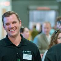 A guest smiling at the Engineering Design Project Preview